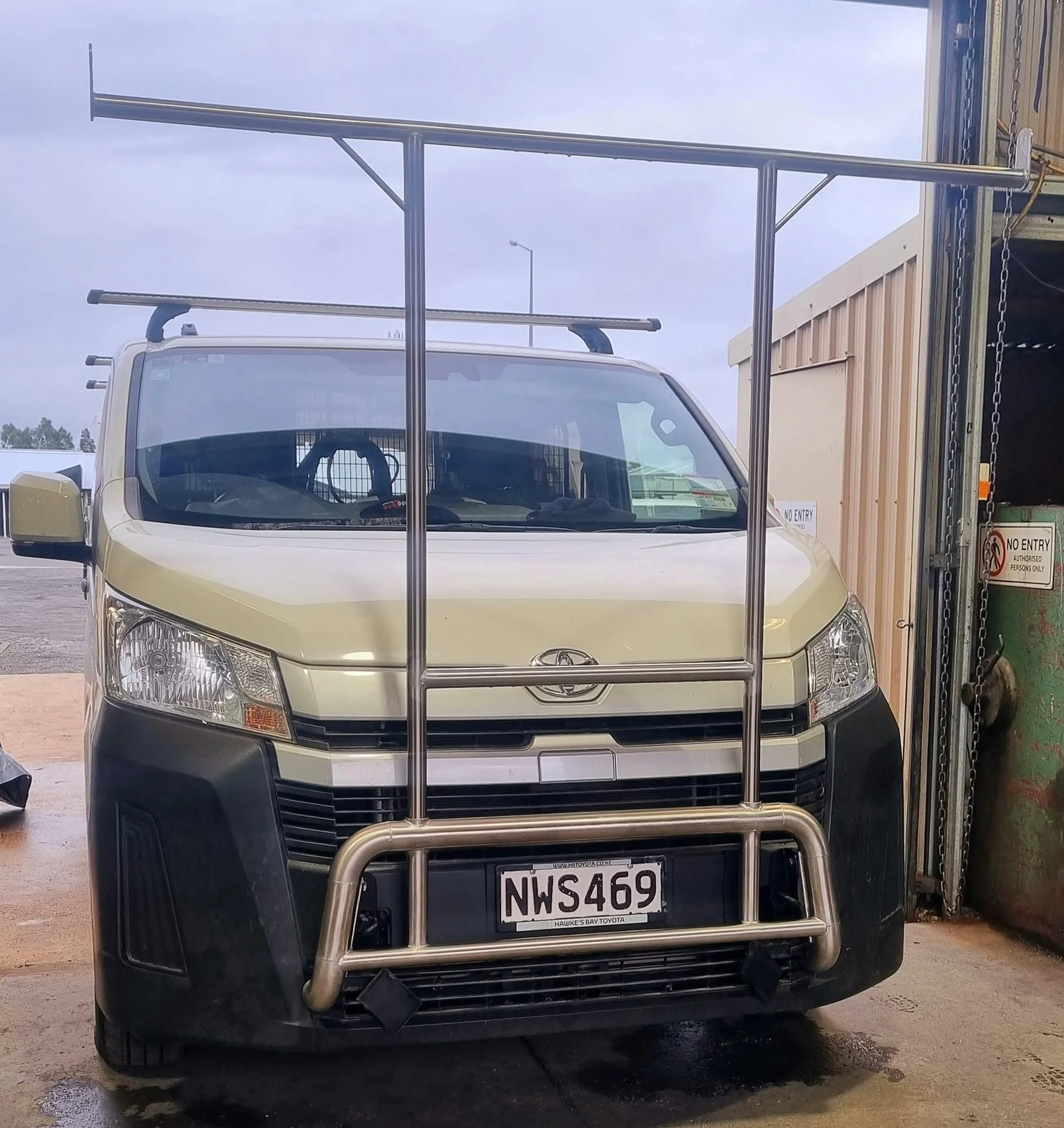 Stainless steel nudge bar and ladder rack fitted to the front of a Toyota van